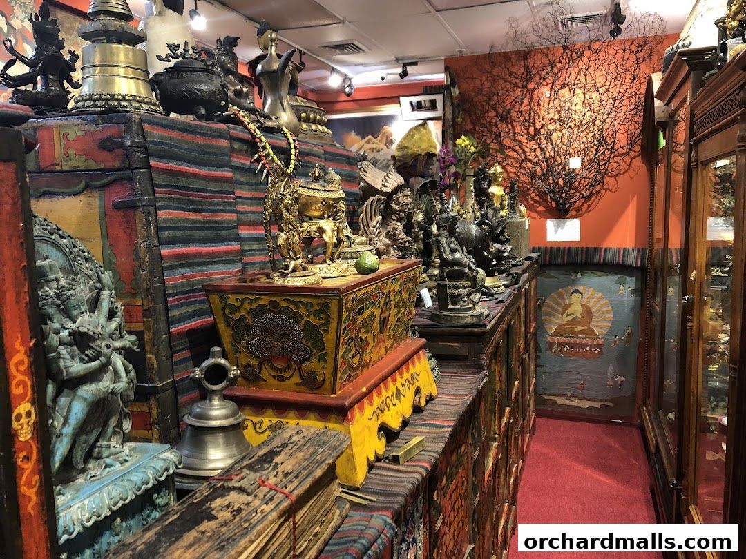 Interior of a shop filled with statues, artifacts, and decorative items.