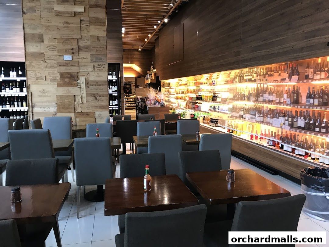 Interior of AP House, a shop with wine displays, seating, and a refrigerated section.