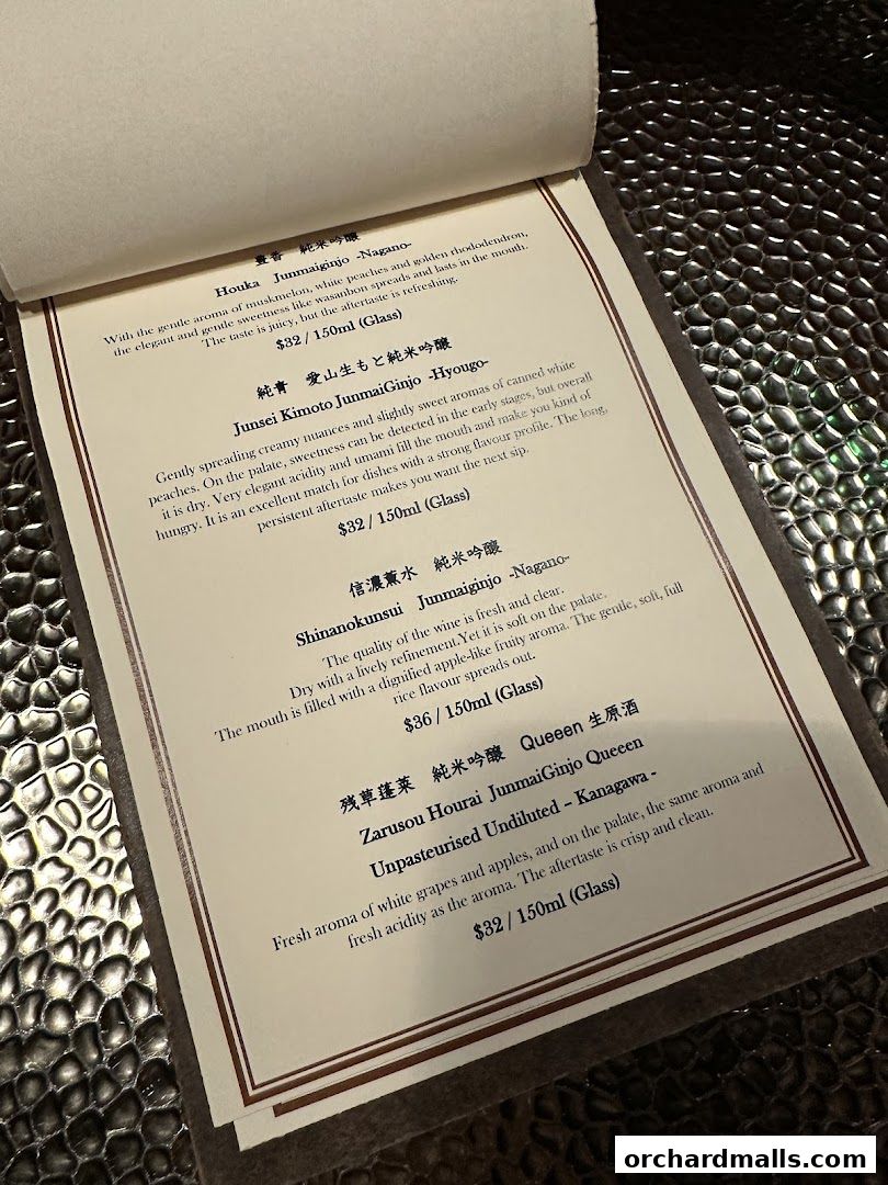 A menu page displaying various types of sake with descriptions and prices.