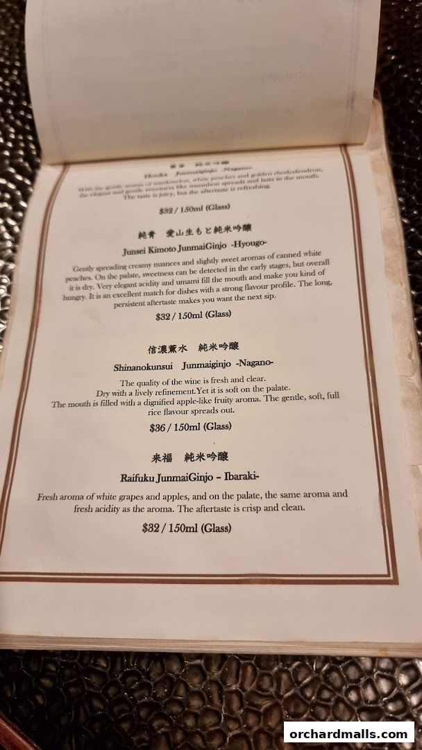 A menu page from Apollon featuring various sake selections with descriptions and prices.
