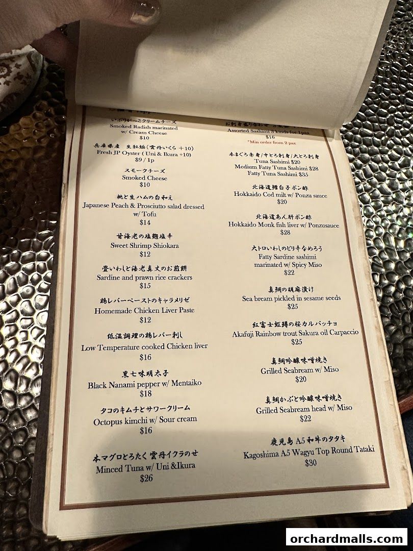 A menu from Apollon restaurant featuring Japanese dishes like sashimi, liver paste, and wagyu.