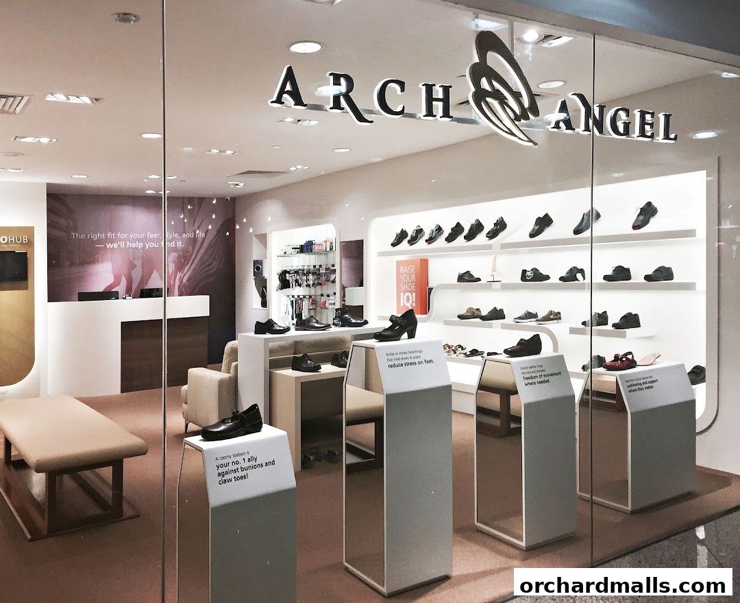 Arch Angel Shoes store interior showcasing various footwear on display shelves and stands.