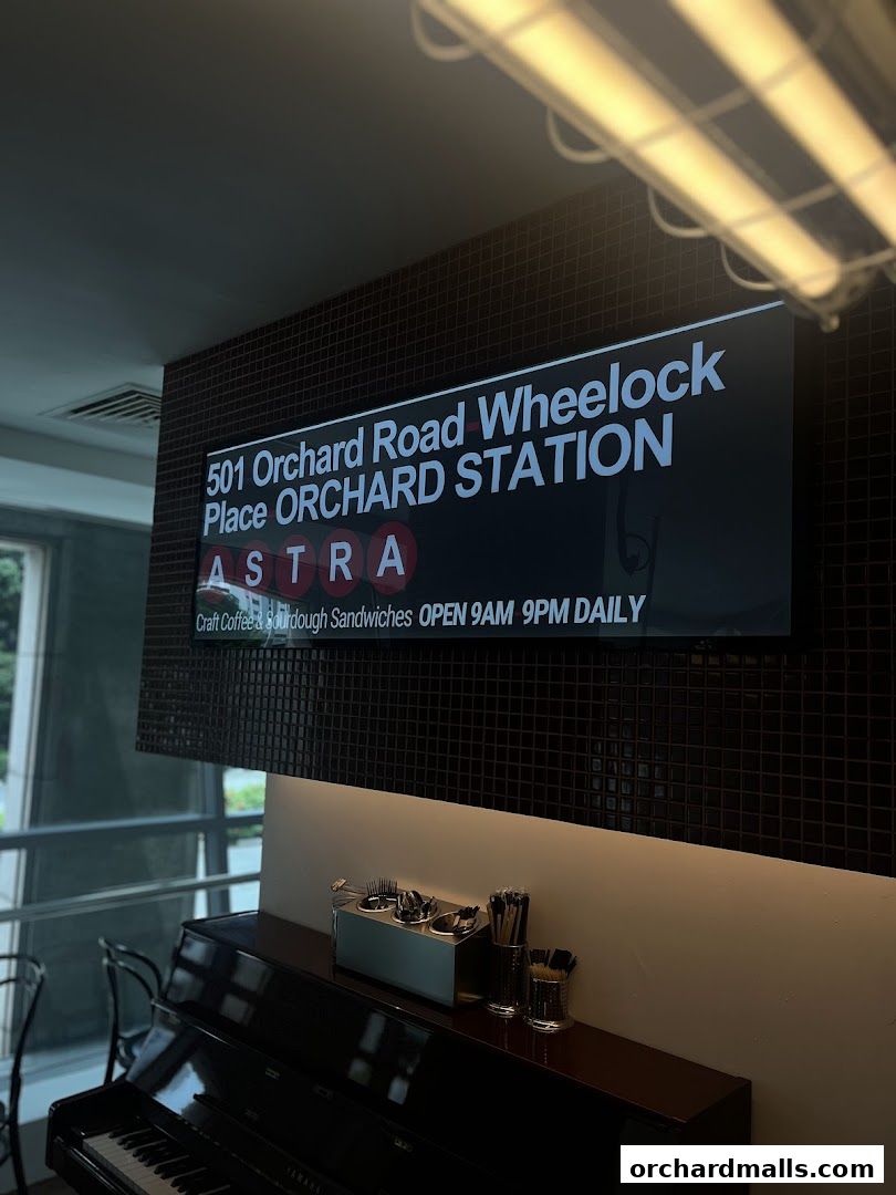 Signage for ASTRA Deli, advertising craft coffee and sourdough sandwiches.