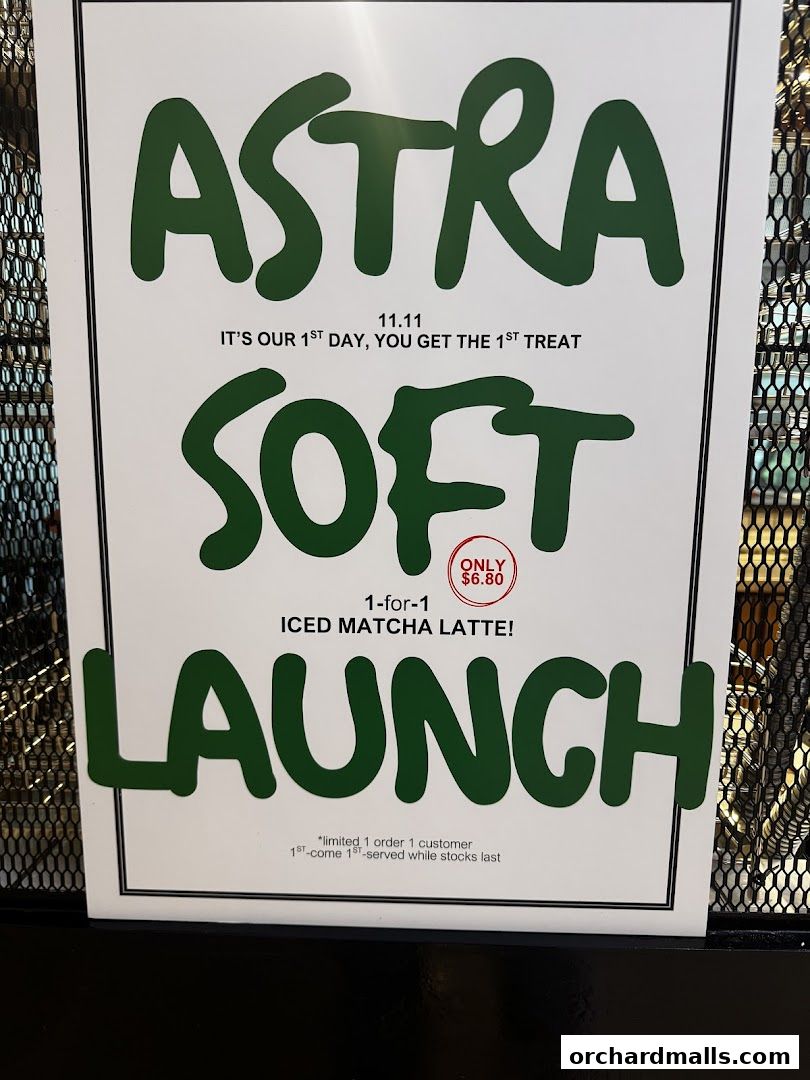A sign announcing ASTRA Deli's soft launch with a 1-for-1 iced matcha latte promotion.