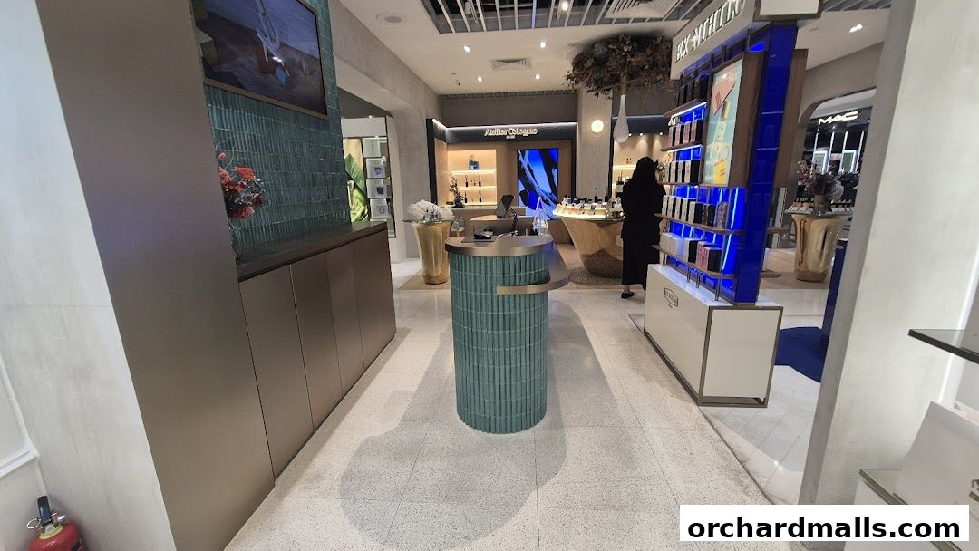 Interior view of a luxury perfume boutique showcasing various brands and products.