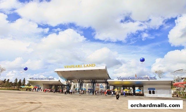 The entrance to Vinpearl Land amusement park under a cloudy blue sky.