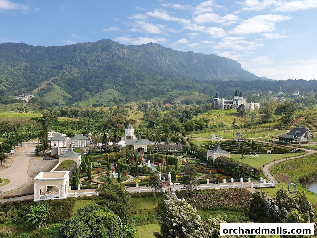 A picturesque landscape featuring European-style architecture and manicured gardens.
