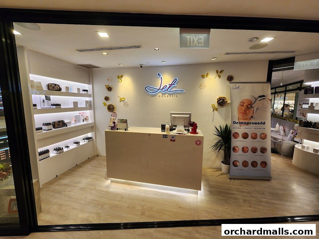 The entrance of AURRA by Jet Concepts, a beauty and wellness shop with products on display.