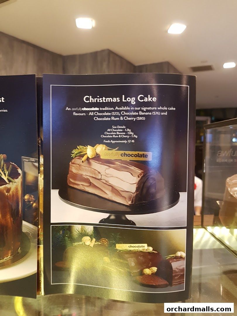 A menu featuring a Christmas Log Cake with different chocolate flavors and sizes.
