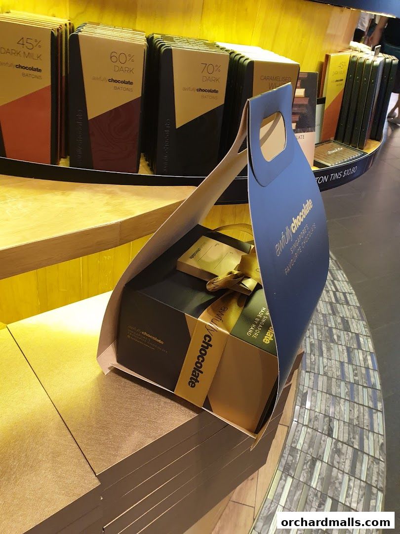A gift box of Awfully Chocolate products displayed in a shop.