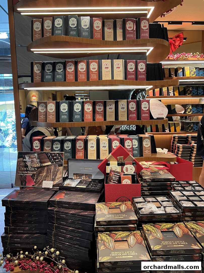 A display of assorted chocolate boxes and gift sets from Awfully Chocolate.
