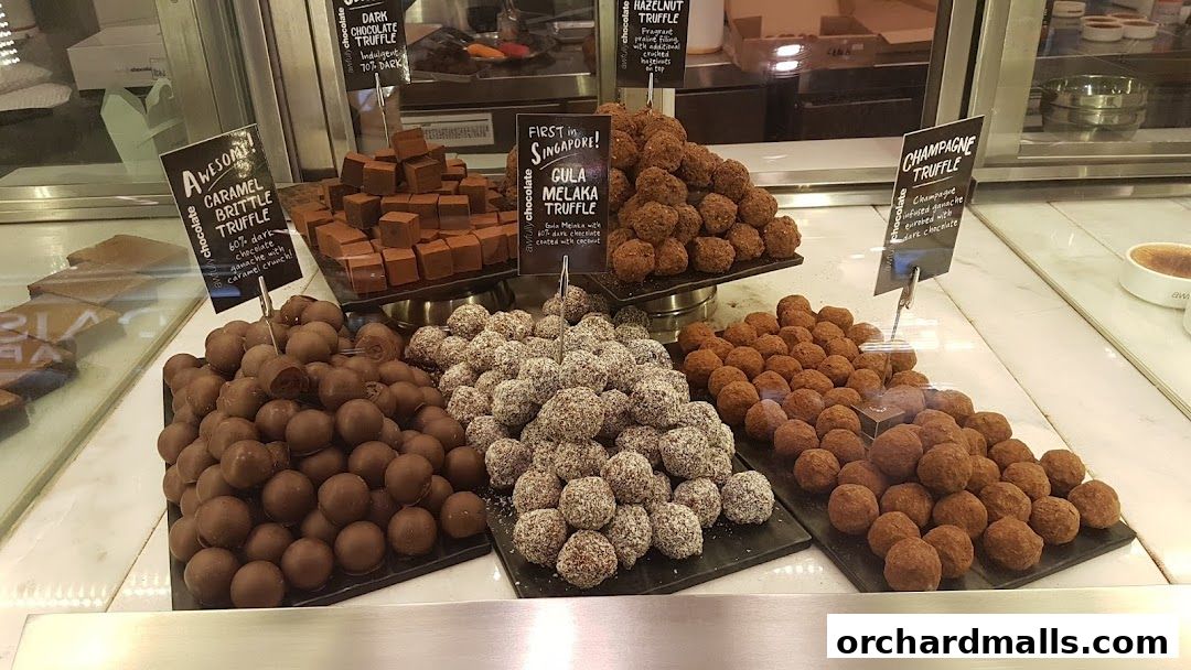A display of various chocolate truffles and treats at Awfully Chocolate.