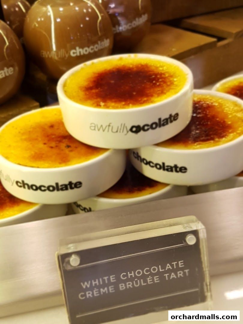 Close-up of Awfully Chocolate's White Chocolate Crème Brûlée Tart and other desserts.