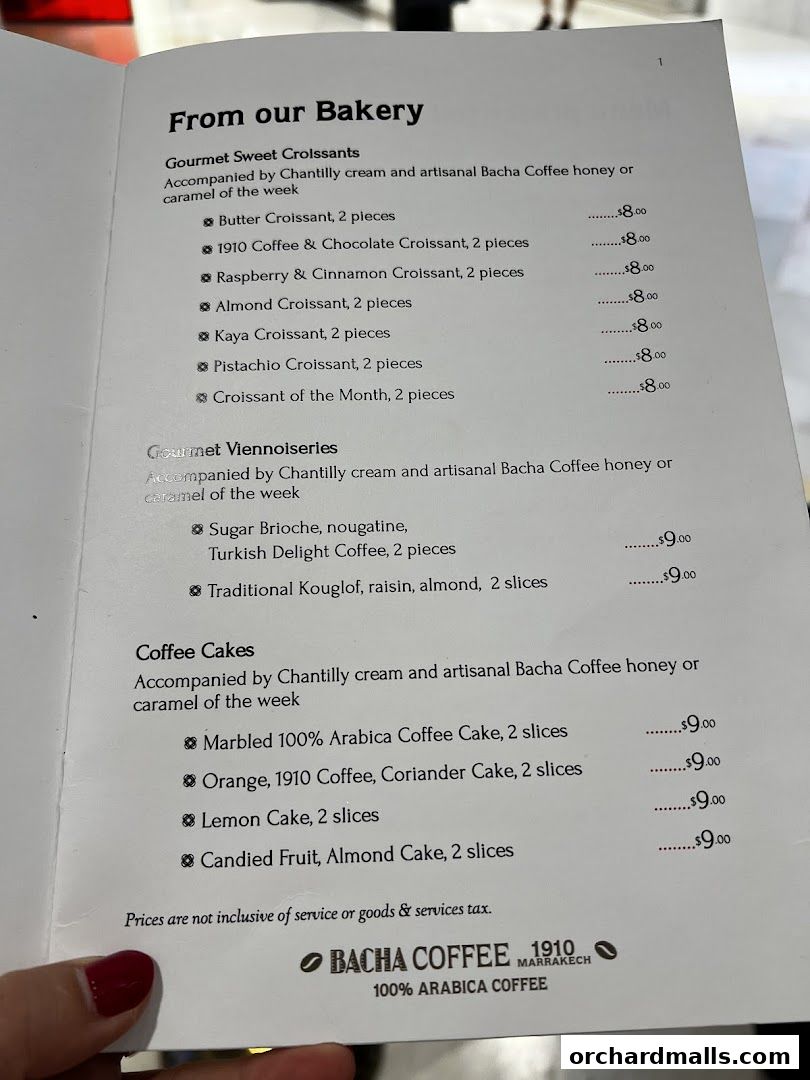 A menu from Bacha Coffee featuring bakery items, viennoiseries, and coffee cakes with prices.