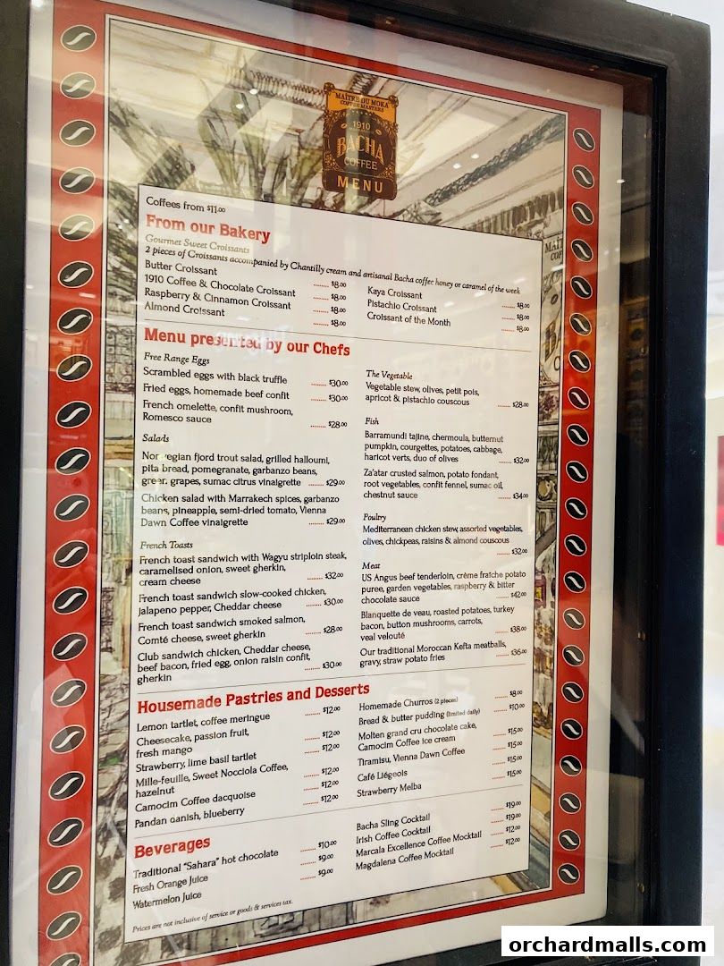 A menu board for Bacha Coffee, featuring a variety of coffees, pastries, and savory dishes.