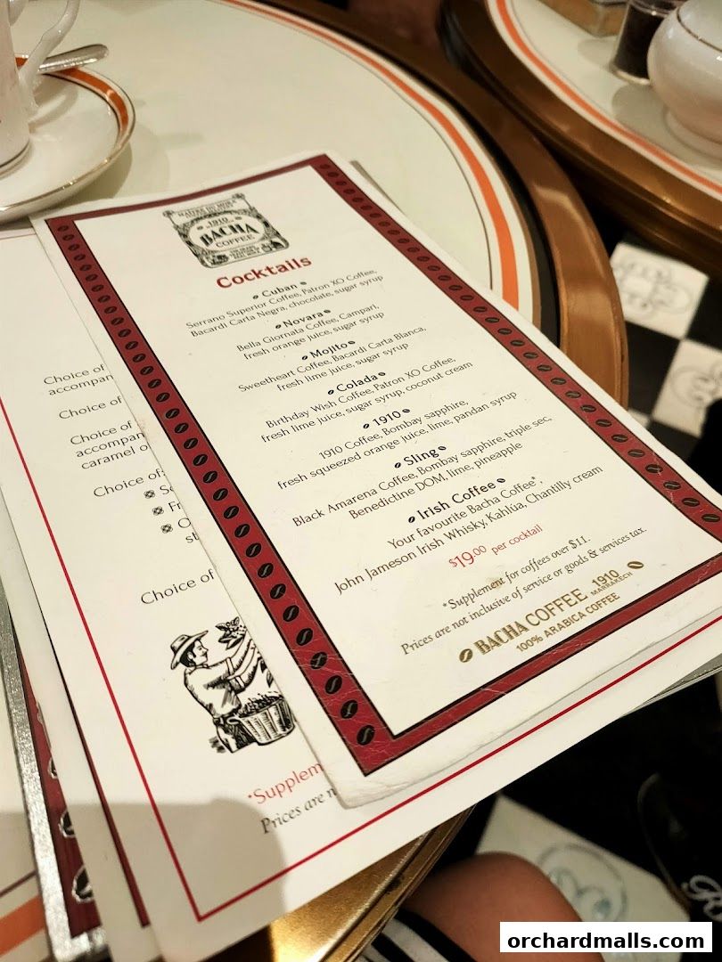 A close-up view of a Bacha Coffee menu featuring a list of cocktails.