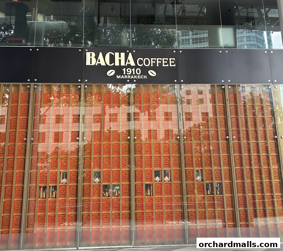 The exterior of Bacha Coffee ION Orchard, featuring a striking display of coffee tins.