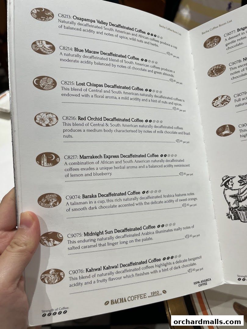 A close-up view of a Bacha Coffee menu featuring various decaffeinated coffee options.