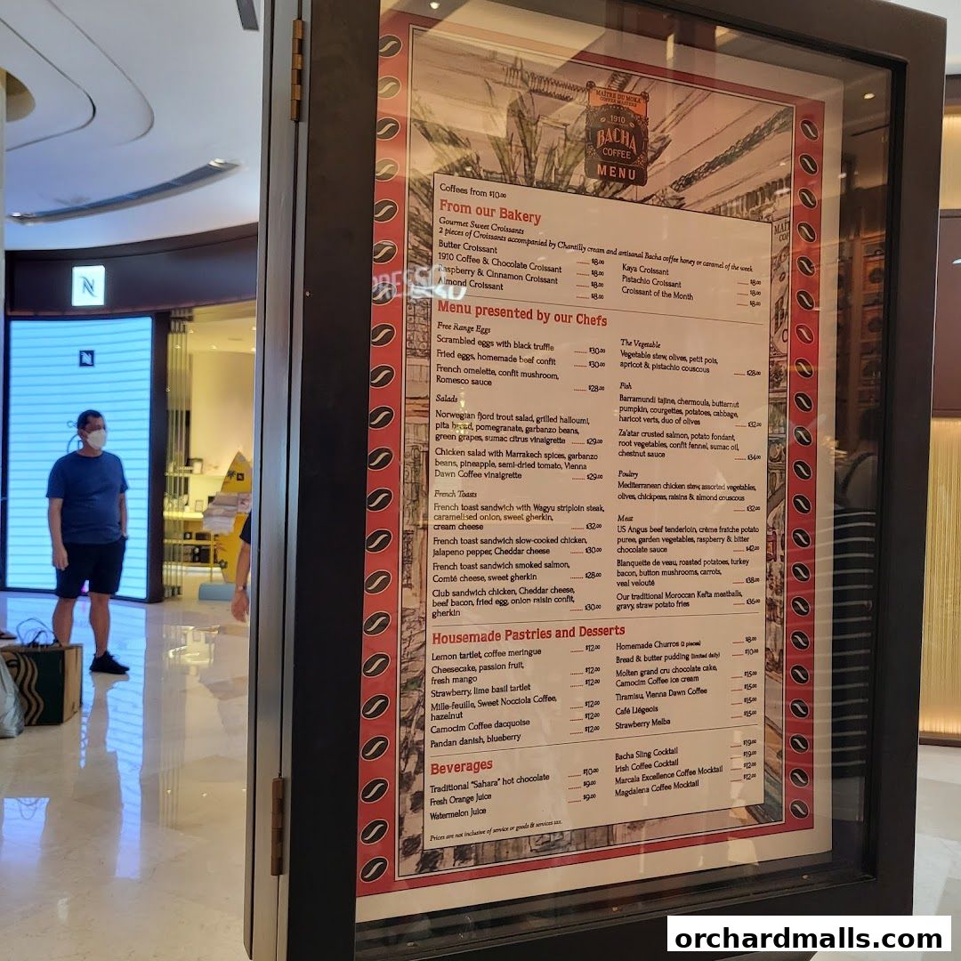 A menu board for Bacha Coffee, showcasing a variety of pastries, desserts, coffees, and beverages.