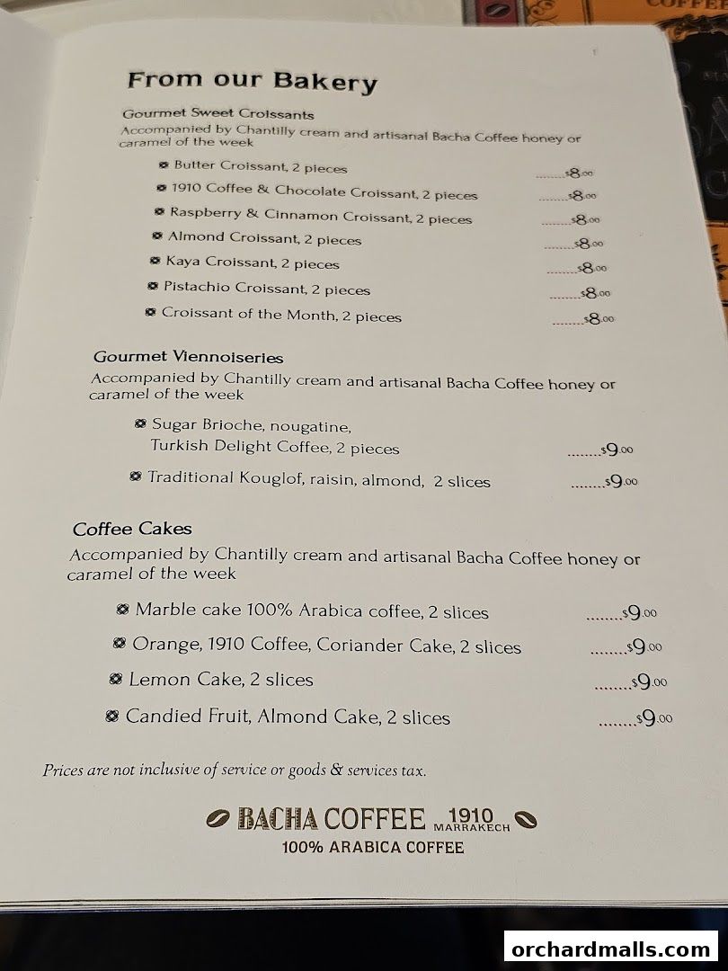 A menu from Bacha Coffee featuring bakery items like croissants, viennoiseries, and coffee cakes with prices.