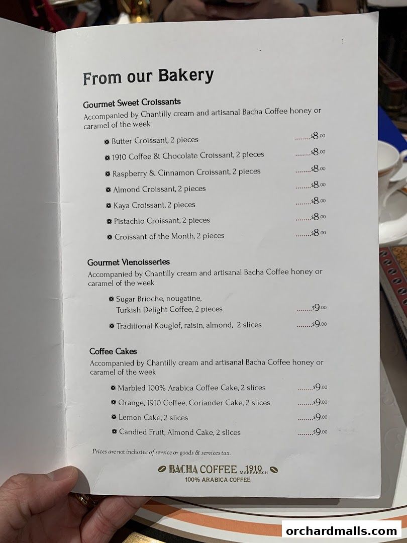 A menu from Bacha Coffee featuring a selection of croissants, viennoiseries, and coffee cakes.