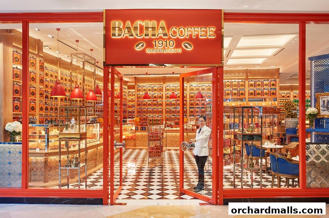 The entrance of Bacha Coffee ION Orchard, showcasing a vibrant interior with coffee products and seating.