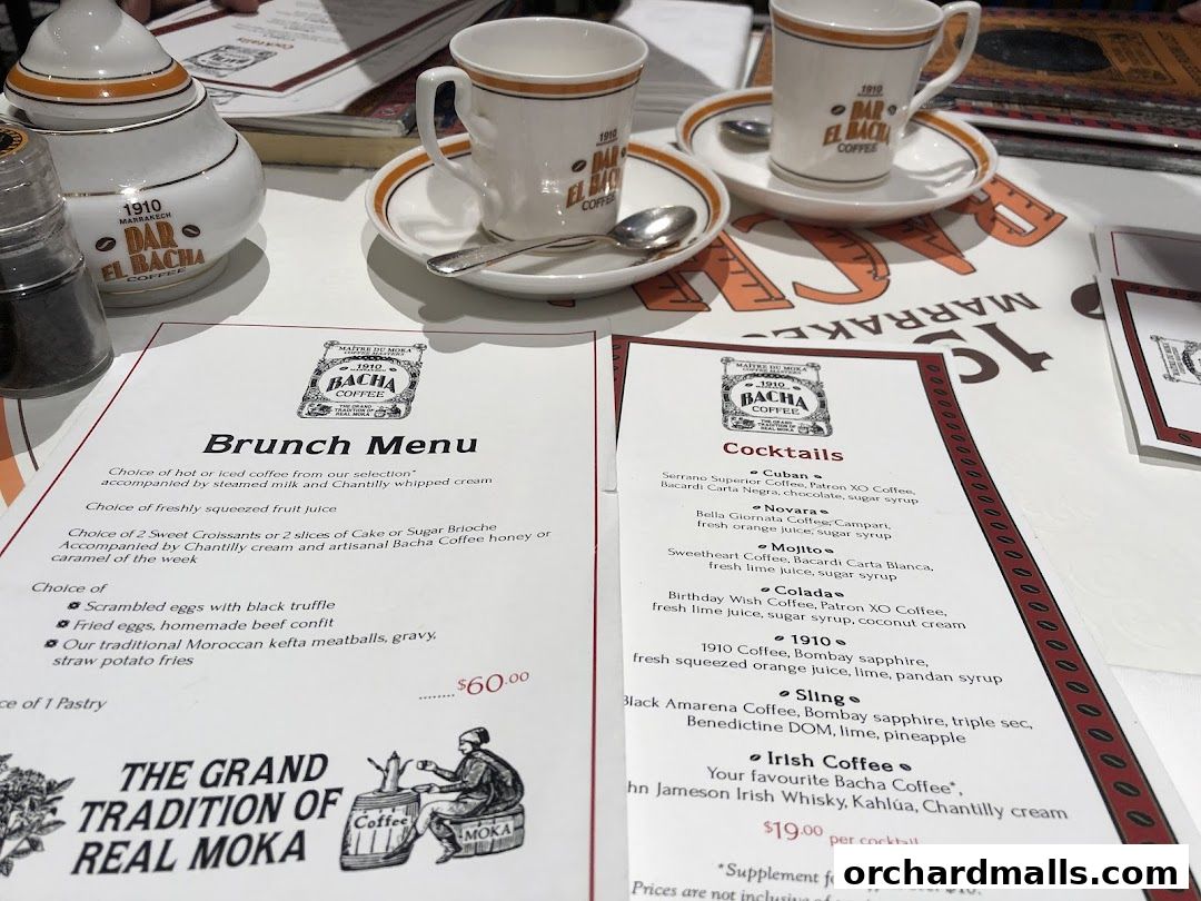 A Bacha Coffee menu featuring brunch and cocktails, with coffee cups and a sugar pot.