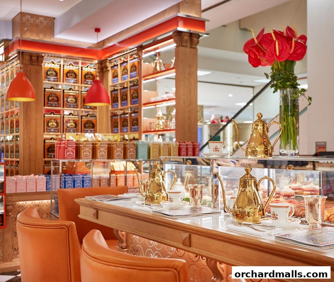 Interior of Bacha Coffee Takashimaya with ornate teapots and shelves of coffee tins.