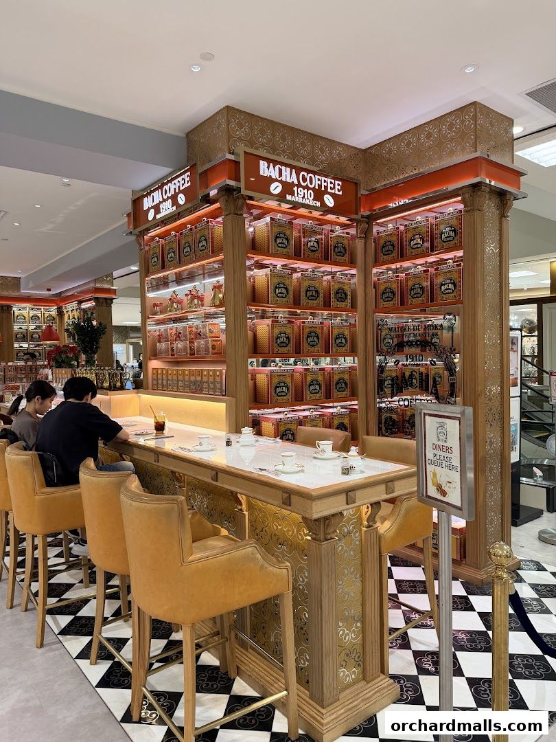 Bacha Coffee shop interior with a bar, coffee tins, and seating.