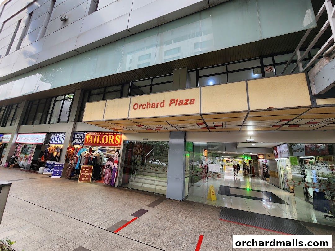 Exterior view of Orchard Plaza shops, featuring tailors and jewelry stores.