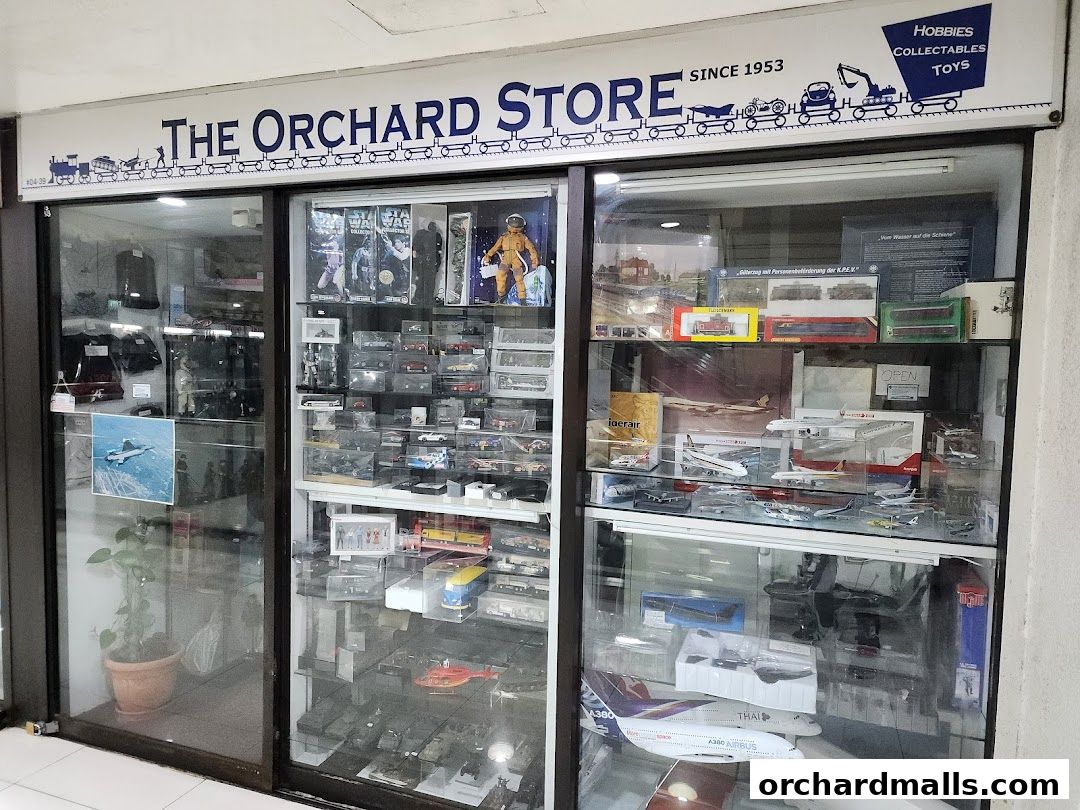 The Orchard Store, a shop selling hobbies, collectibles, and toys, with display windows showcasing models.