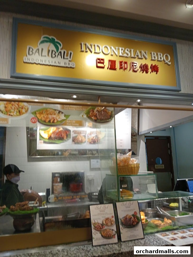 The front of BaliBali Indonesian BBQ with a prominent sign and food displays.
