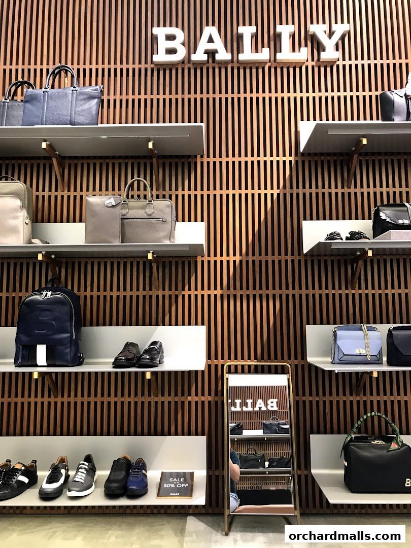 Bally store interior showcasing handbags, shoes, and accessories on wooden slatted walls.