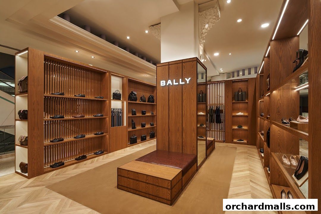 Interior view of a Bally store showcasing shoes and handbags on wooden shelves.