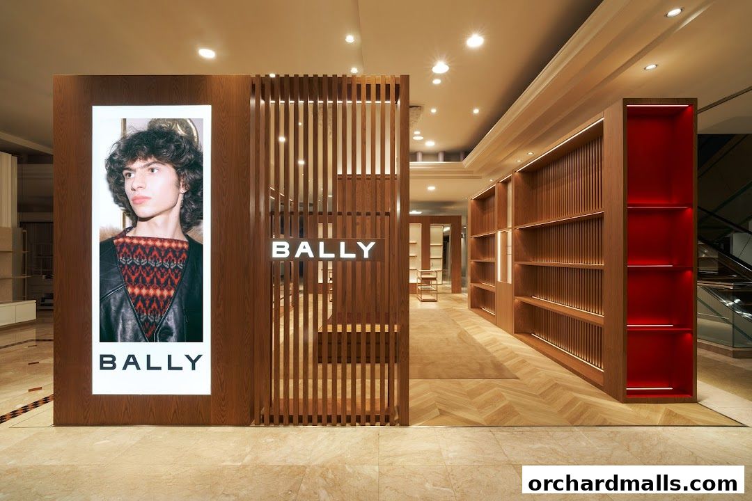 Interior view of a modern Bally store with wooden shelving and a large advertisement.