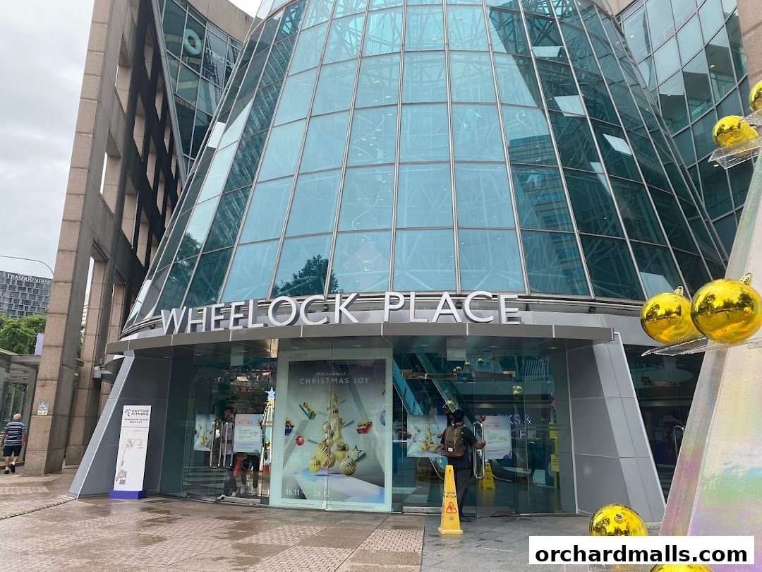 The entrance of Wheelock Place mall with festive Christmas decorations.