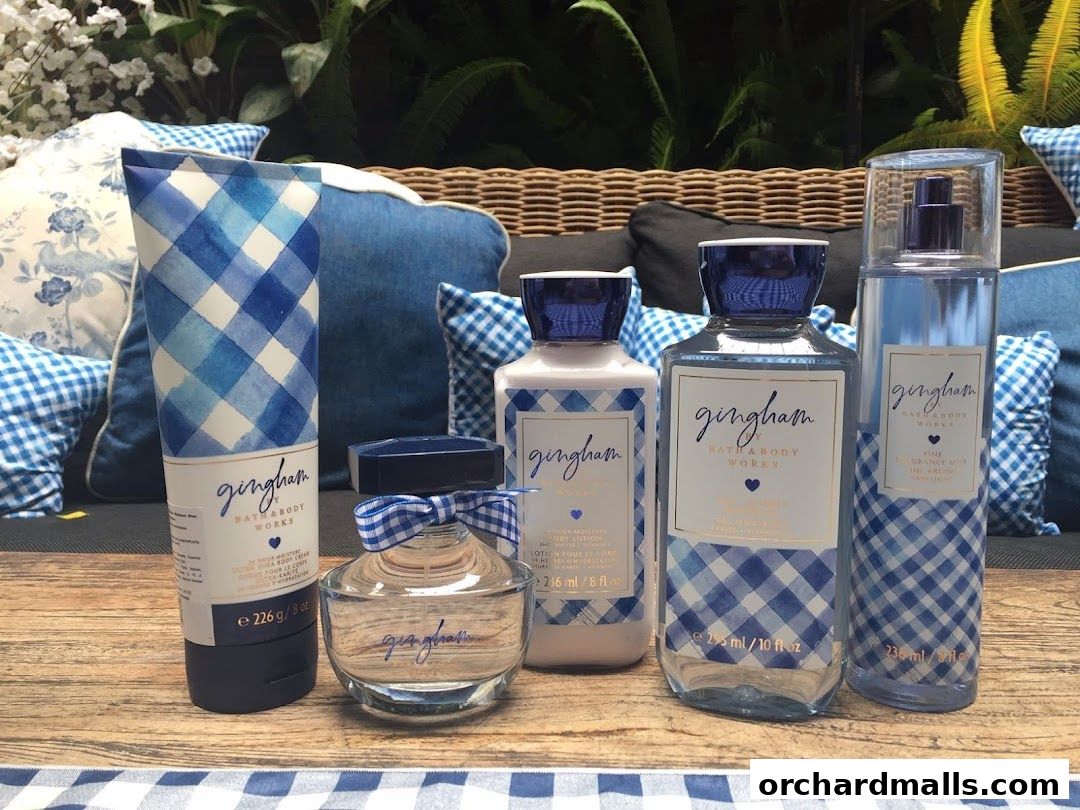 Bath & Body Works Gingham collection products displayed on a wooden surface with blue gingham accents.