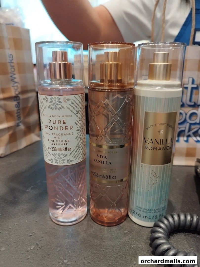 Three Bath & Body Works fine fragrance mists are displayed on a surface.