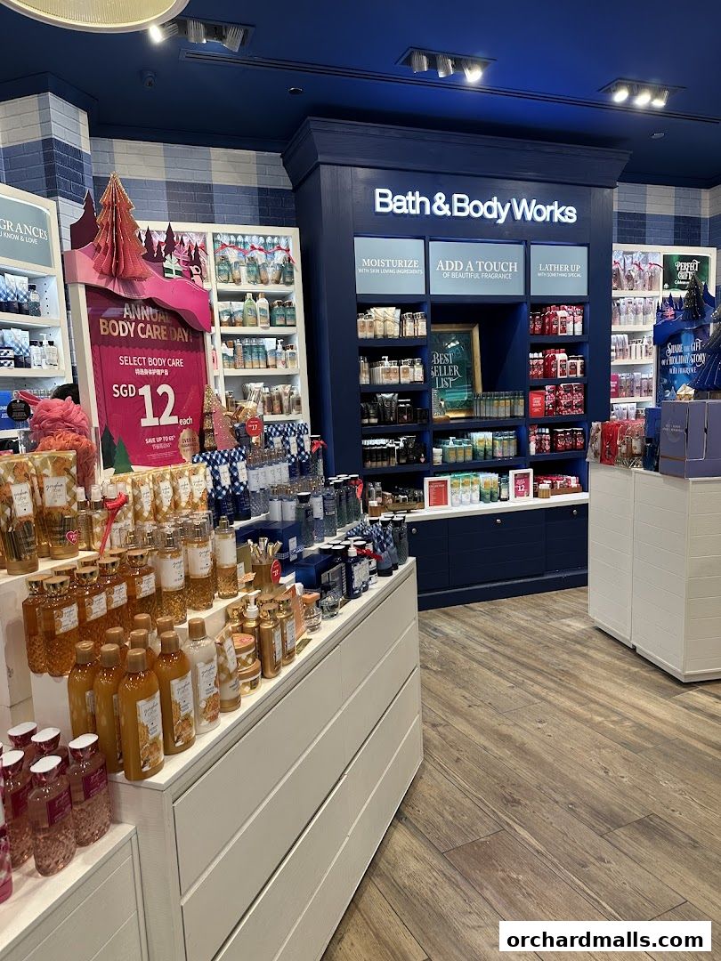 Interior view of Bath & Body Works showcasing shelves filled with body care products and promotional displays.