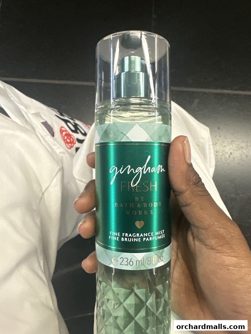 A hand holds a Bath & Body Works Gingham Fresh fine fragrance mist.