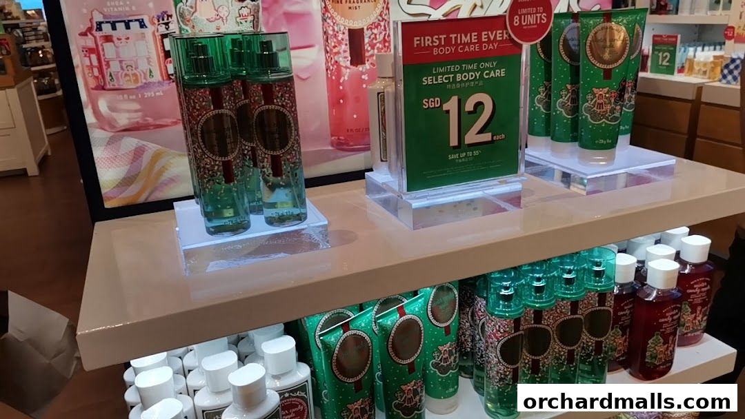 Bath & Body Works display featuring body care products and a promotional sign.