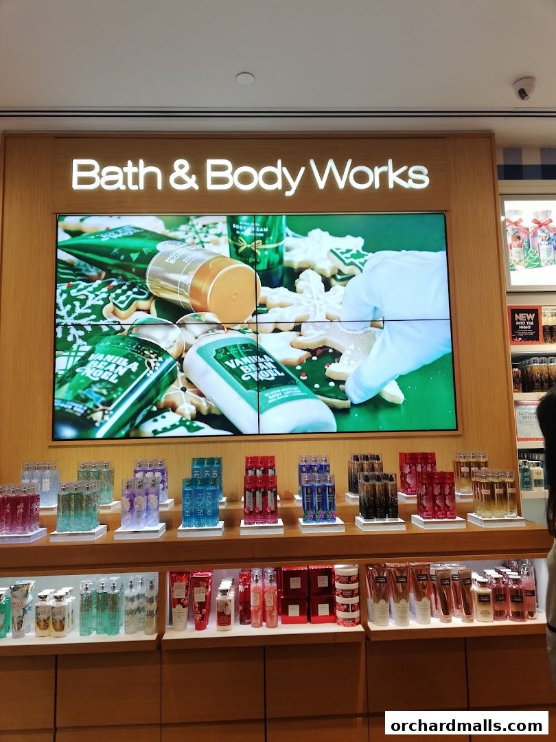 Bath & Body Works shop interior with display shelves filled with lotions and body care products.
