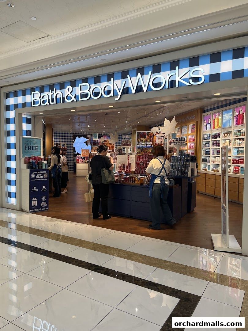 The entrance of Bath & Body Works shop with products displayed inside.