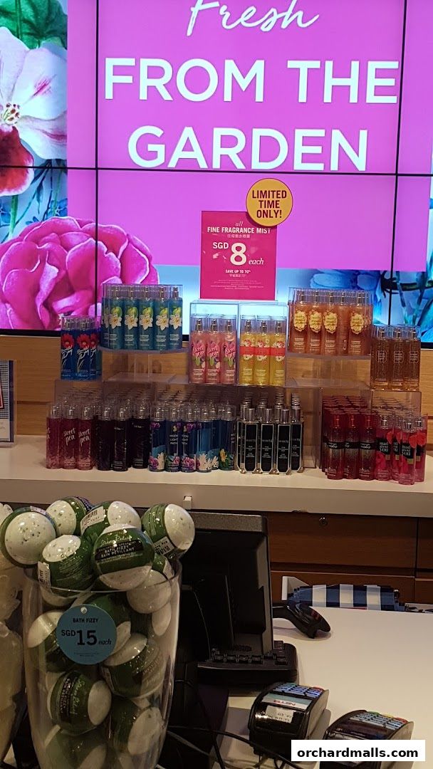 Bath & Body Works display featuring fine fragrance mists and bath fizzies with promotional signage.