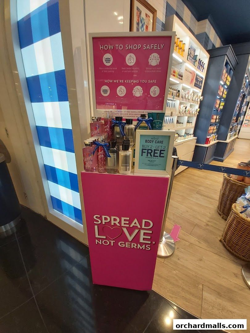 Bath & Body Works shop interior with promotional display and safety guidelines.