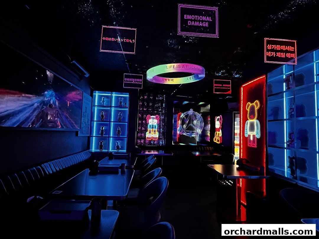 Interior of a neon-lit bar with bear-themed decor and glowing signs.