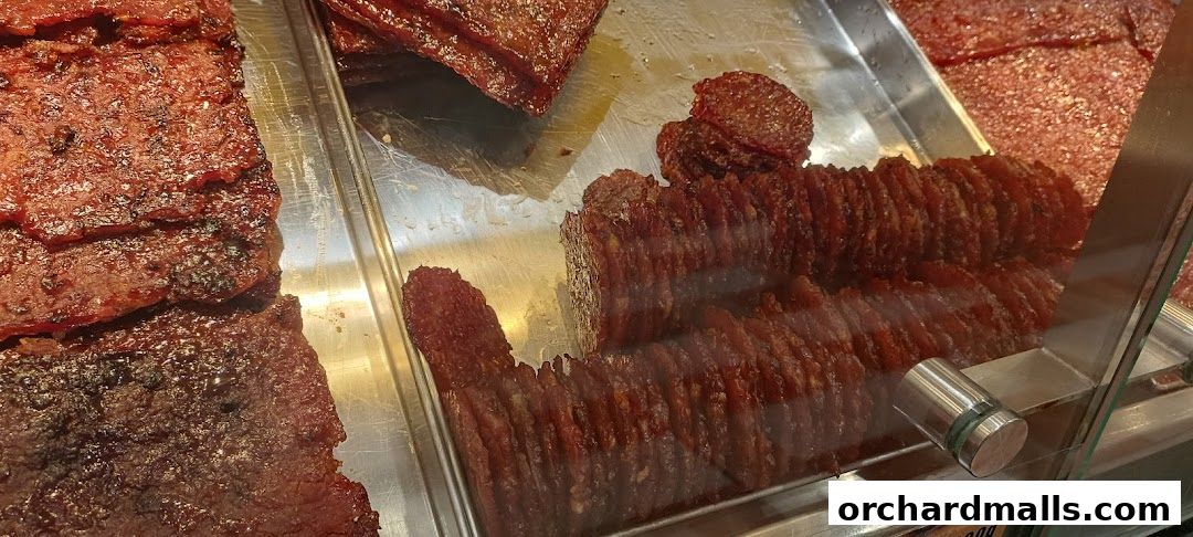Close-up of delicious bak kwa slices displayed in a retail setting.