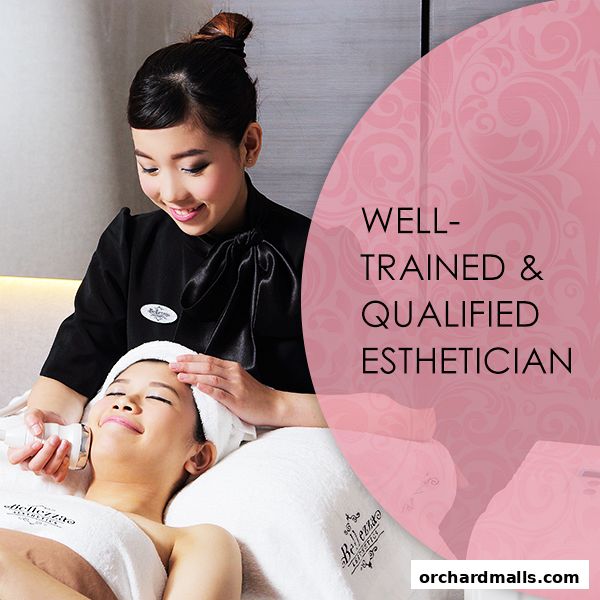 Aesthetician performing a facial treatment on a client at Bellezza Aesthetics.