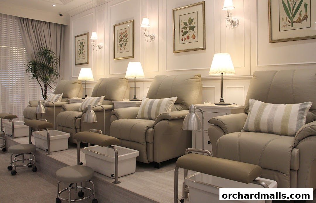 Luxurious pedicure chairs with foot baths and decorative art in a salon.