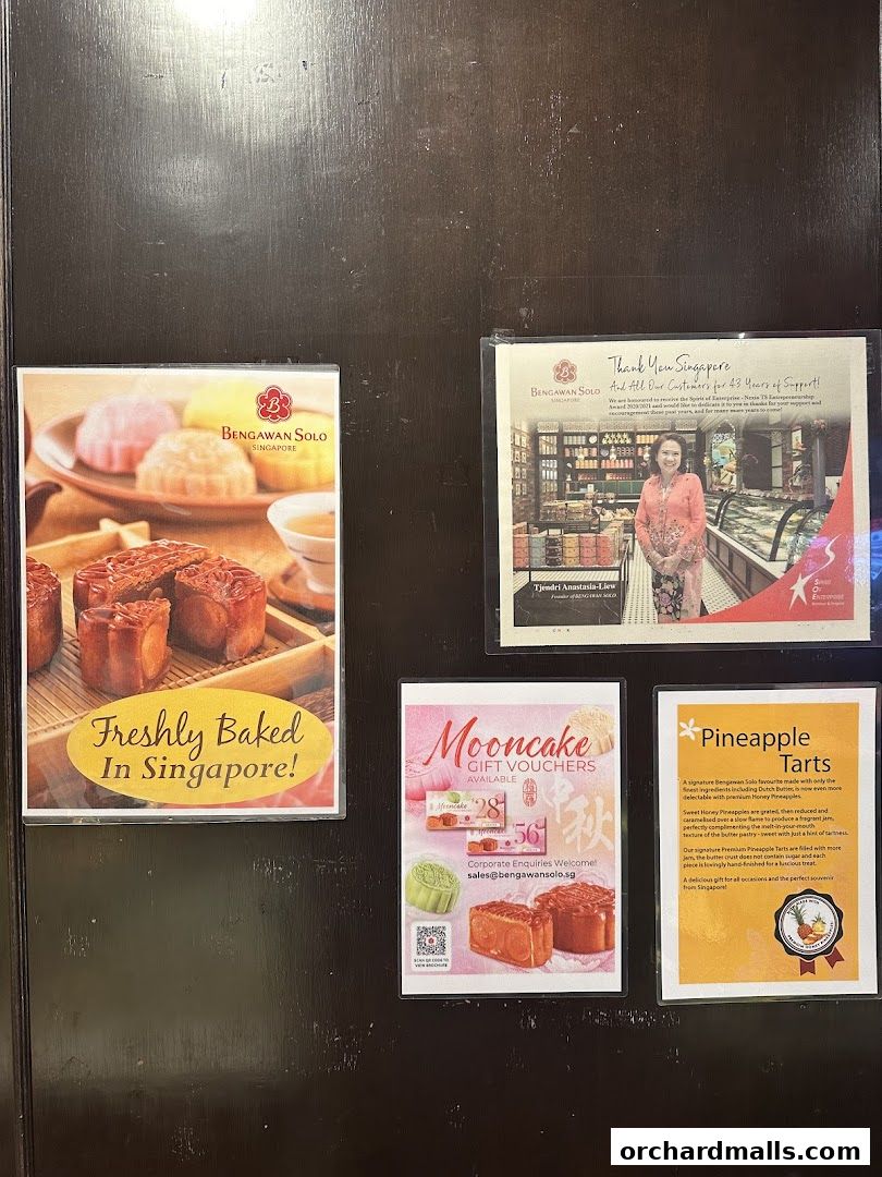 A display of flyers and posters for Bengawan Solo, showcasing baked goods and promotions.